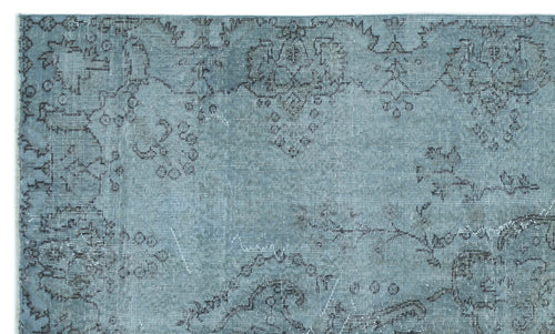 Load image 1 in gallery view. Dusty blue rug with a distressed, dark grey traditional floral medallion pattern.