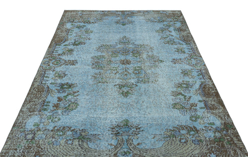 Load image 1 in gallery view. Distressed light blue rug with a central floral medallion and brown ornate border on a white background.