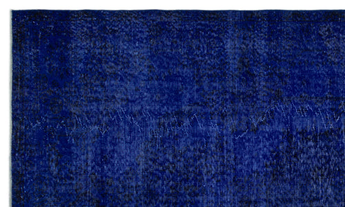 Load image 1 in gallery view. Deep blue vintage-style rug with a distressed, overdyed texture and subtle black tonal variations.