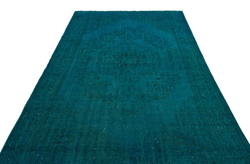 Load image 1 in gallery view. Teal distressed rug with a traditional central medallion and ornate border pattern on a white background.