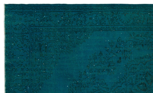 Load image 1 in gallery view. Teal monochromatic rug with a distressed, traditional floral medallion pattern and a detailed border.