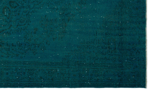 Load image 1 in gallery view. Teal distressed rug with a faint, traditional medallion pattern and subtle white flecks.