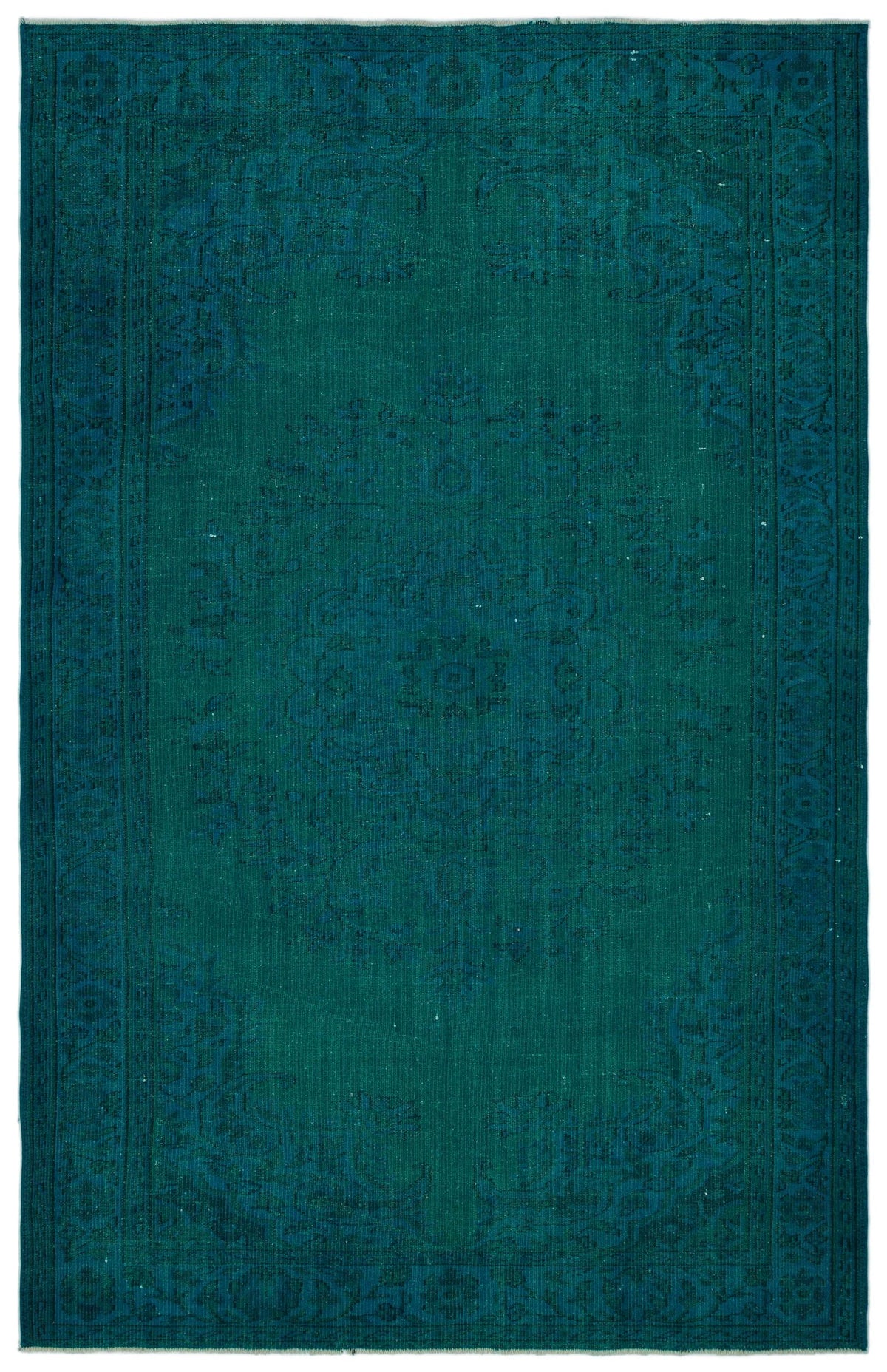 Teal monochromatic rug with a traditional central medallion and ornate border pattern.