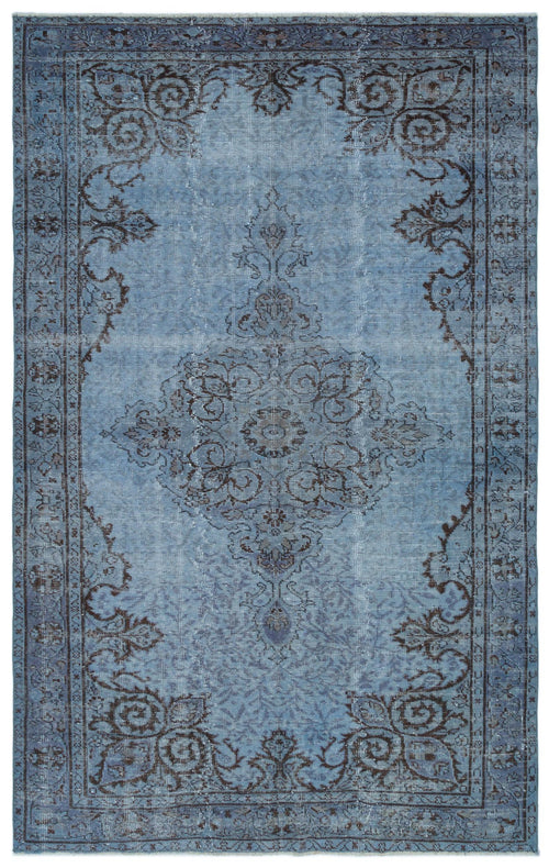 Load image 1 in gallery view. Blue and charcoal distressed traditional rug with a central floral medallion and ornate border.