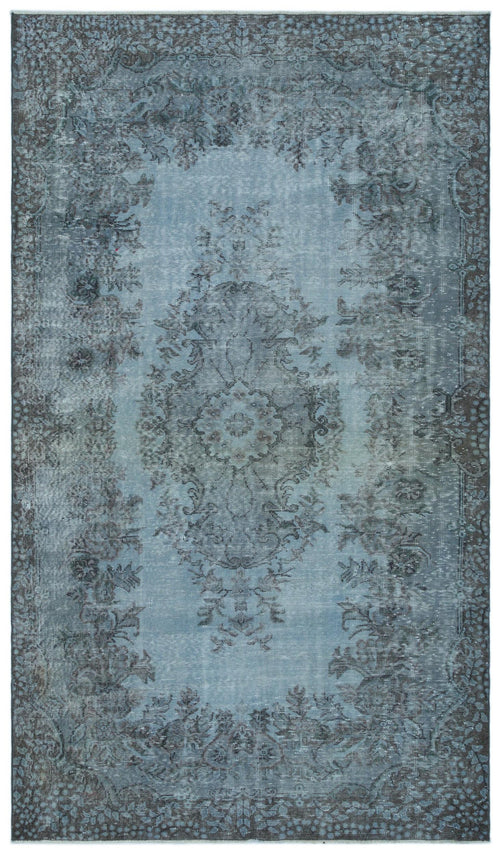 Load image 1 in gallery view. Distressed blue and charcoal traditional rug with a central floral medallion and ornate border.