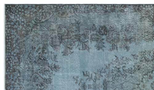 Load image 1 in gallery view. Blue and charcoal grey distressed rug with a traditional floral medallion pattern.