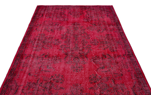 Load image 1 in gallery view. Deep red vintage-style rug with a distressed black floral medallion pattern on a white background.