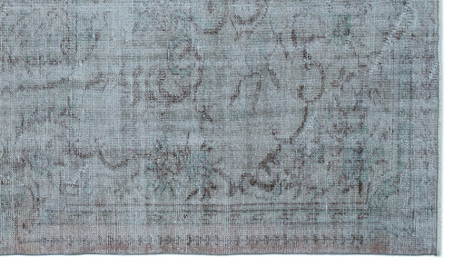 Load image 1 in gallery view. Distressed light blue and grey rug with a faded traditional medallion pattern and a bordered edge.