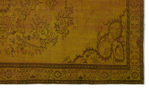 Load image 1 in gallery view. Mustard yellow vintage rug with a dark brown floral border and distressed traditional pattern.
