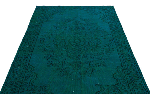 Load image 1 in gallery view. Teal vintage-style rug with a dark green traditional floral medallion pattern on a white background.