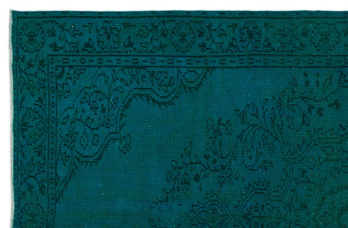 Load image 1 in gallery view. Teal rug with a dark, intricate traditional floral border and corner medallion pattern.