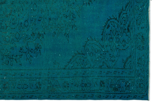 Load image 1 in gallery view. Teal monochromatic rug with a distressed, faded traditional floral pattern and a bordered edge on a white background.