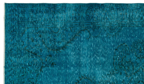 Load image 1 in gallery view. Teal distressed rug with a faint, dark traditional floral pattern and visible woven texture.