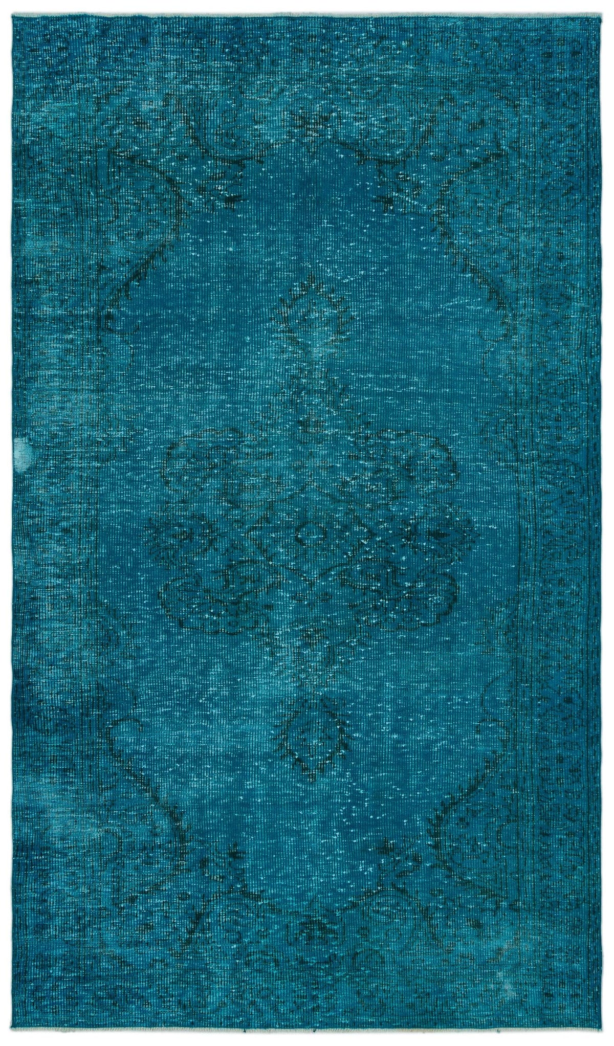 Teal distressed rug with a faded central medallion and traditional border pattern.