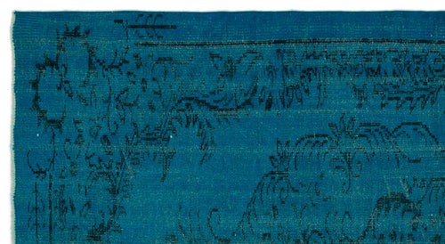 Load image 1 in gallery view. Teal rug with a distressed black floral and vine pattern.