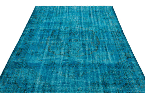 Load image 1 in gallery view. Bright turquoise distressed rug with a faded central medallion and traditional border pattern on a white background.