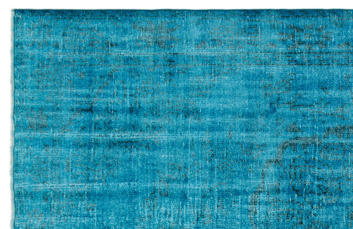 Load image 1 in gallery view. Bright turquoise rug with a distressed, faded traditional pattern and dark charcoal accents.