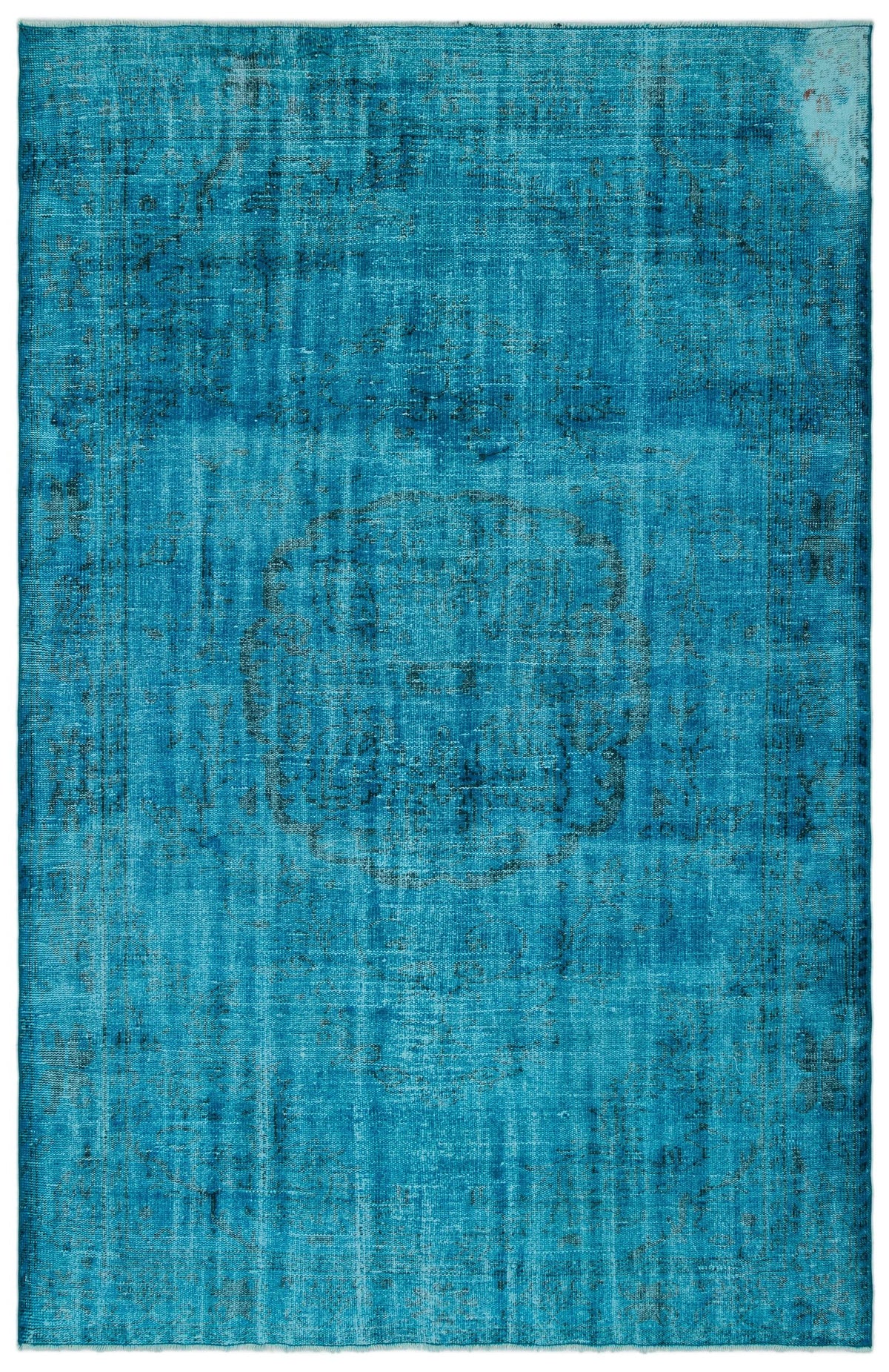 Bright turquoise distressed rug with a faded central medallion and traditional border pattern.