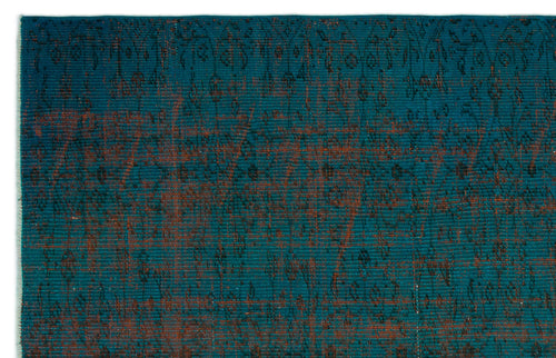 Load image 1 in gallery view. Teal rug with a distressed, dark brown traditional floral pattern and visible woven texture.