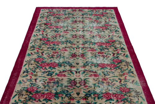 Load image 1 in gallery view. Distressed beige rug with a floral pattern in red and teal, featuring a solid deep red border.