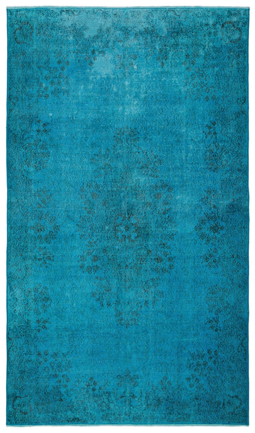 Load image 1 in gallery view. Bright turquoise rug with a distressed, faded floral medallion pattern and a decorative border.