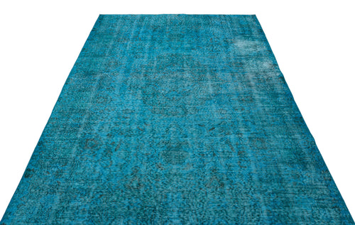 Load image 1 in gallery view. Bright turquoise distressed area rug with a faded traditional medallion pattern on a white background.
