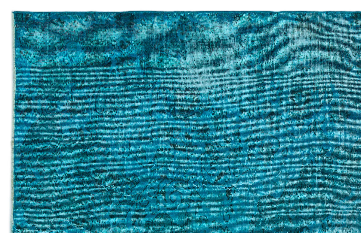 Teal and turquoise distressed rug with a faded traditional floral medallion pattern on a white background.