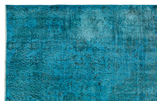Load image 1 in gallery view. Teal and turquoise distressed rug with a faded traditional floral medallion pattern on a white background.