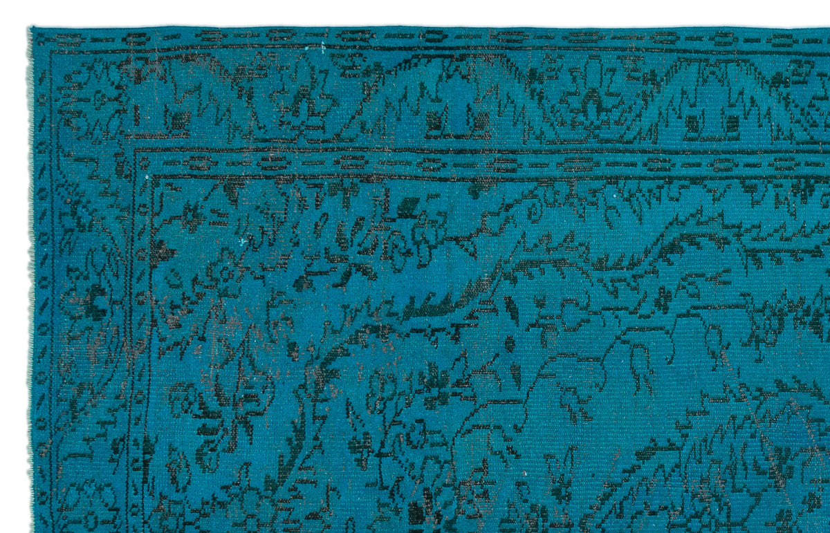 Teal rug with a dark charcoal traditional floral border and medallion pattern.