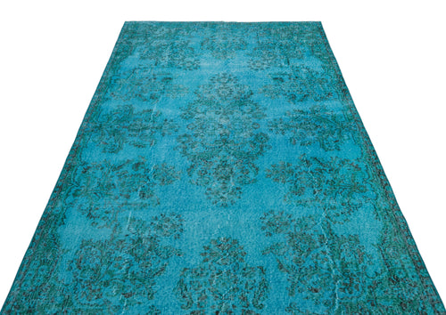 Load image 1 in gallery view. Bright turquoise distressed rug with a dark teal traditional floral medallion pattern on a white background.