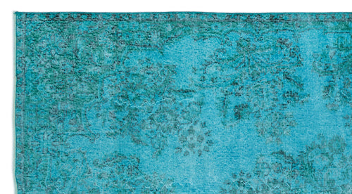 Load image 1 in gallery view. Turquoise and teal distressed rug with a faded traditional floral medallion pattern.