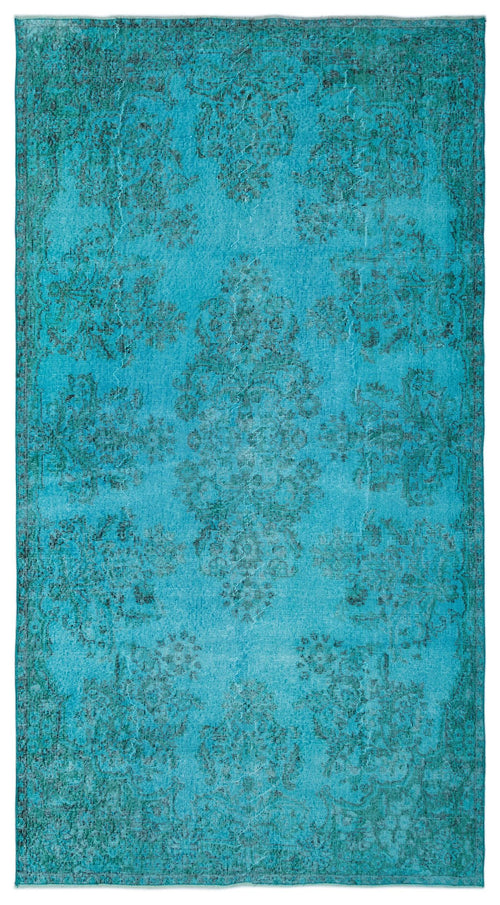 Load image 1 in gallery view. Bright turquoise distressed rug with a dark teal traditional floral medallion pattern.