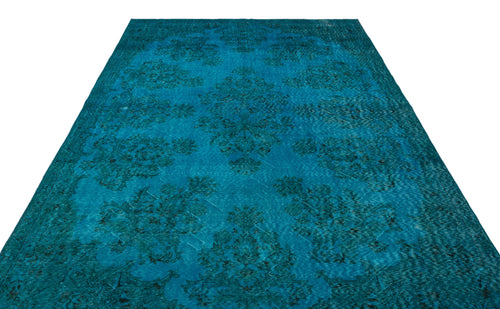 Load image 1 in gallery view. Teal distressed area rug with a dark floral medallion pattern on a white background.