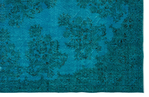 Load image 1 in gallery view. Teal rug with a distressed, monochromatic floral medallion pattern and a detailed border.