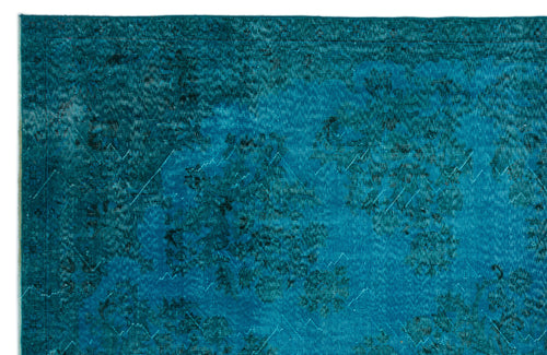Load image 1 in gallery view. Teal and dark blue distressed rug with a faded traditional floral medallion pattern.