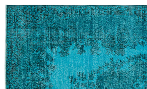 Load image 1 in gallery view. Teal and dark blue distressed rug with a faded traditional floral pattern.