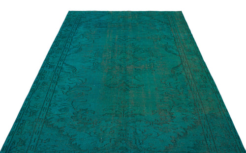 Load image 1 in gallery view. Teal vintage-style rug with a faded black floral medallion pattern on a white background.