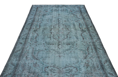 Load image 1 in gallery view. Distressed teal and charcoal rug with a traditional central medallion and ornate border pattern on a white background.