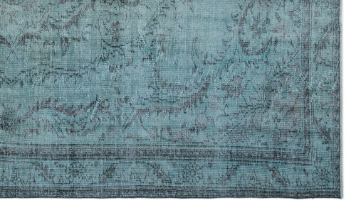 Load image 1 in gallery view. Teal and charcoal distressed rug with a faded traditional floral medallion pattern.