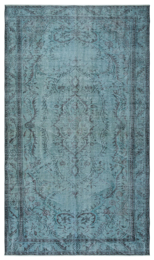 Load image 1 in gallery view. Distressed teal and charcoal rug with a traditional central medallion and ornate floral border.