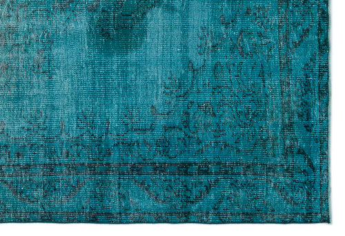 Load image 1 in gallery view. Teal and black distressed rug with a traditional floral medallion border pattern.