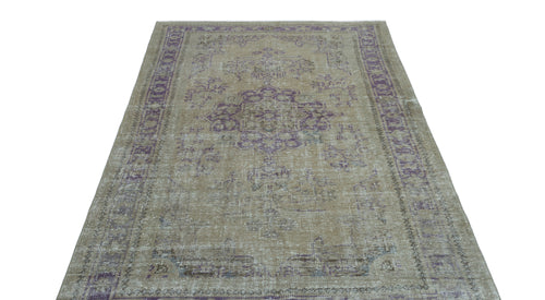 Load image 1 in gallery view. Distressed beige and purple vintage-style rug with a central medallion and ornate border pattern.