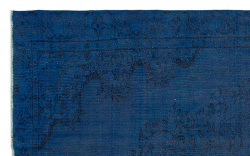 Load image 1 in gallery view. Deep blue rug with a black traditional floral border and medallion pattern.
