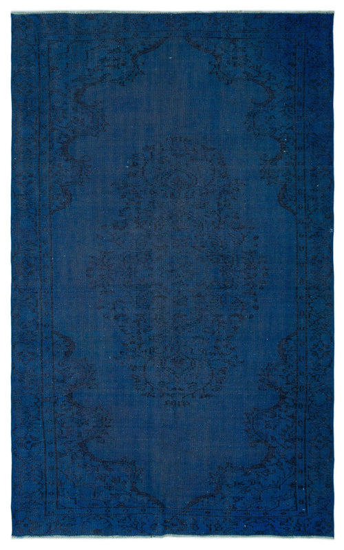 Load image 1 in gallery view. Monochromatic navy blue rug with a subtle, dark-toned traditional floral medallion pattern.
