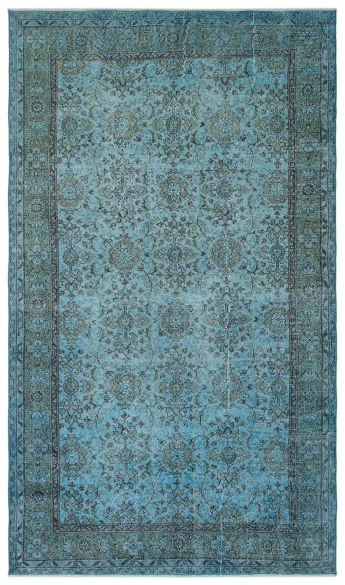 Load image 1 in gallery view. Distressed turquoise and charcoal rug with a traditional floral medallion pattern and a wide decorative border.