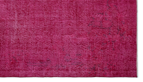 Load image 1 in gallery view. Magenta overdyed vintage rug with a distressed, faded texture and subtle dark charcoal pattern details.