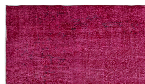 Load image 1 in gallery view. Magenta distressed rug with a faded, textured appearance and subtle dark charcoal accents.