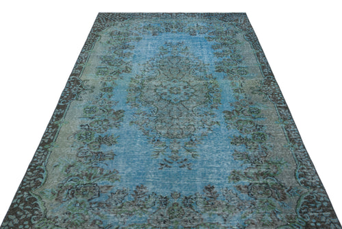 Load image 1 in gallery view. Distressed blue and grey traditional rug with a central floral medallion and ornate border pattern.