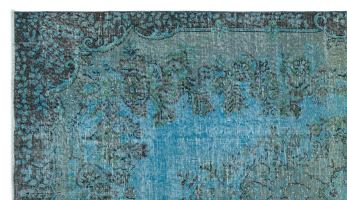 Load image 1 in gallery view. Teal and charcoal distressed rug with a traditional floral medallion pattern and ornate border.