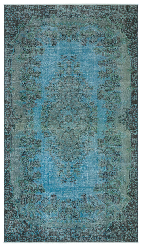Load image 1 in gallery view. Blue and charcoal distressed traditional rug with a central floral medallion and ornate border.